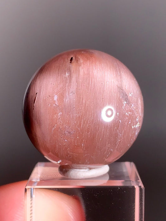 High-Clarity Pink Amphibole Sphere with Silky Textured Inclusions