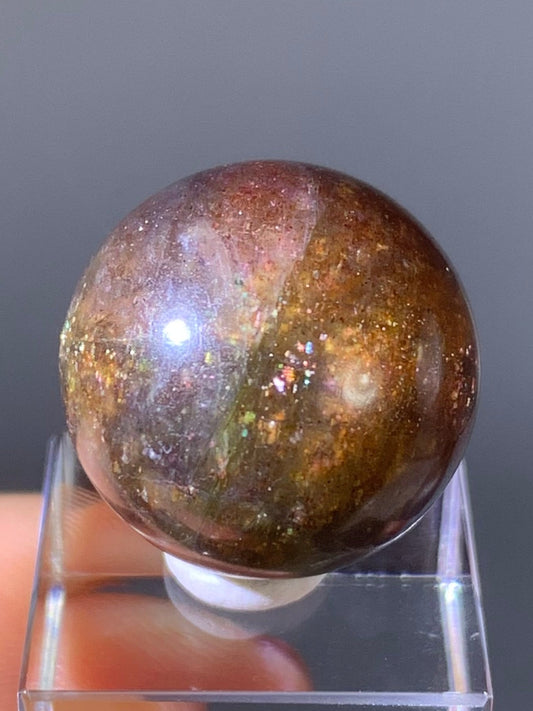 Natural High-Grade Galaxy Iolite and Sunstone Bloodshot Sphere from Tanzania