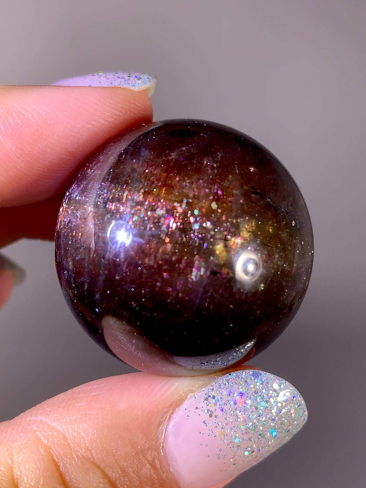 Collector-Grade Galaxy Iolite & Sunstone Bloodshot Sphere | Tanzania