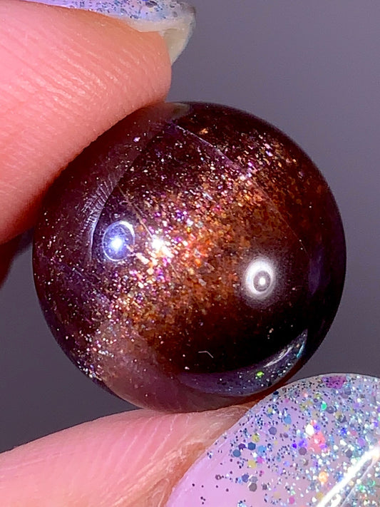 High-Grade Galaxy Iolite & Sunstone Bloodshot Sphere | Tanzania