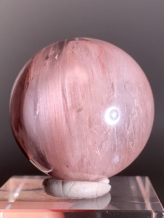 High-Clarity Pink Amphibole Sphere with Silky Textured Inclusions