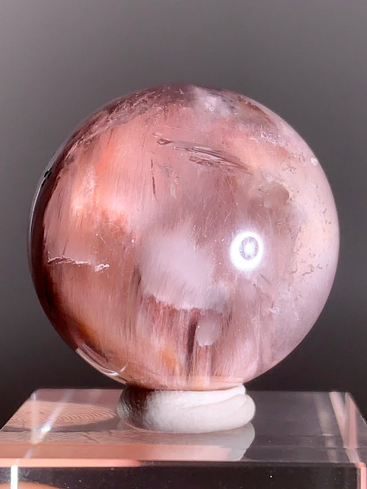 High-Clarity Pink Amphibole Sphere with Silky Textured Inclusions