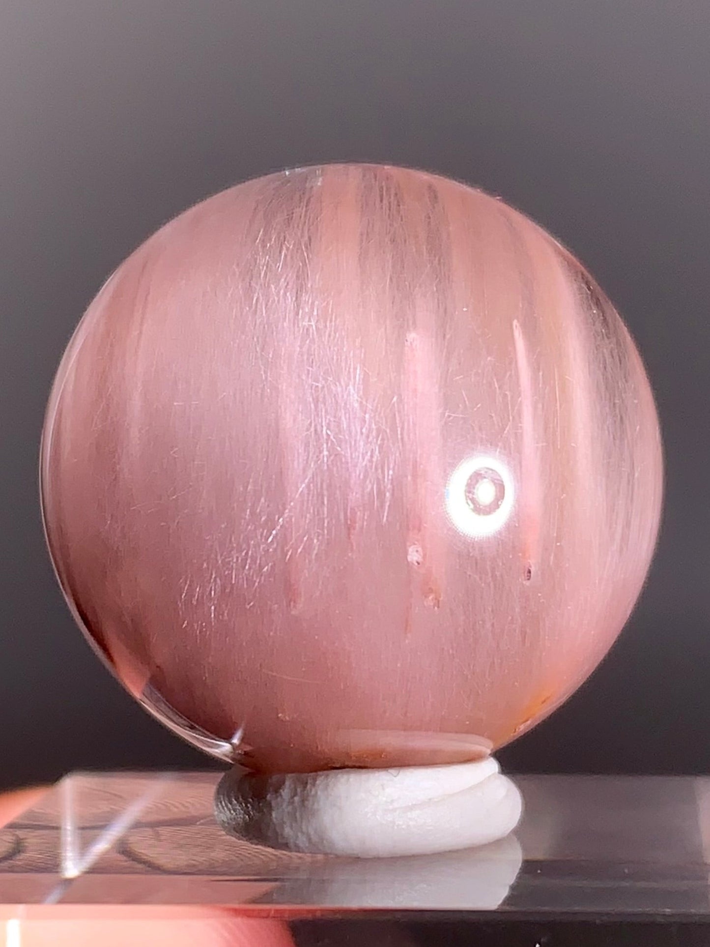 High-Clarity Pink Amphibole Sphere with Silky Textured Inclusions