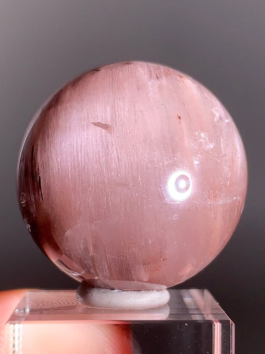 High-Clarity Pink Amphibole Sphere with Silky Textured Inclusions