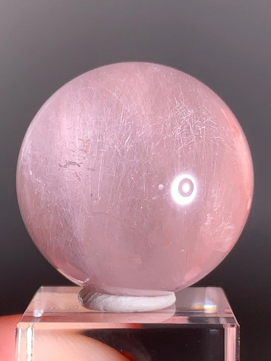 High-Clarity Pink Amphibole Sphere with Silky Textured Inclusions
