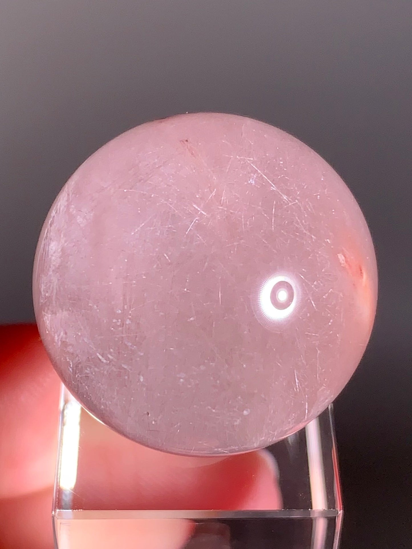 High-Clarity Pink Amphibole Sphere with Silky Textured Inclusions