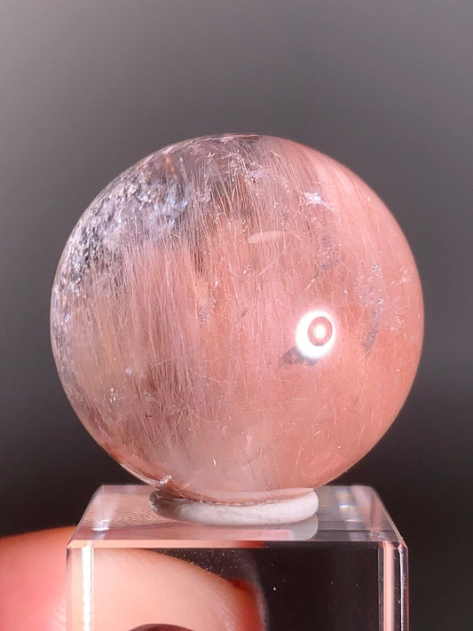 High-Clarity Pink Amphibole Sphere with Silky Textured Inclusions