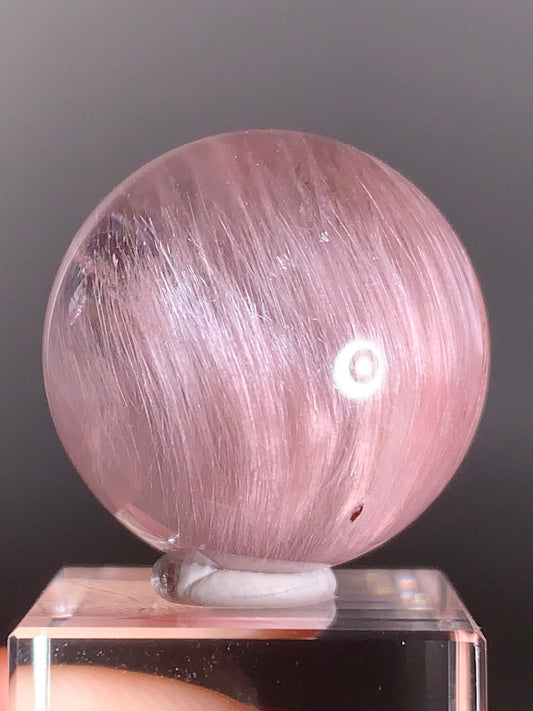 High-Clarity Pinkish Purple Amphibole Sphere with Silky Textured Inclusions