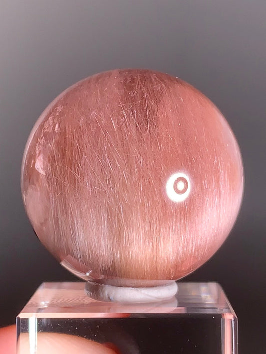 High-Clarity Pink Amphibole Sphere with Silky Textured Inclusions