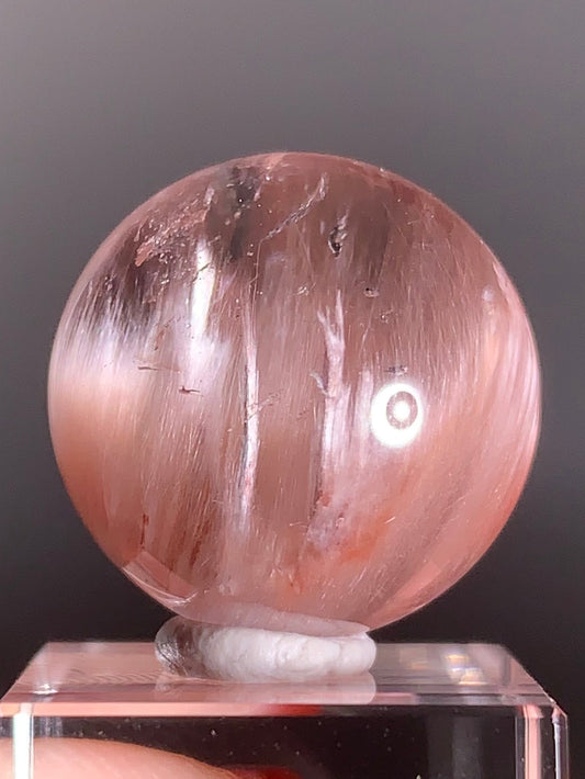 High-Clarity Pink Amphibole Sphere with Silky Textured Inclusions