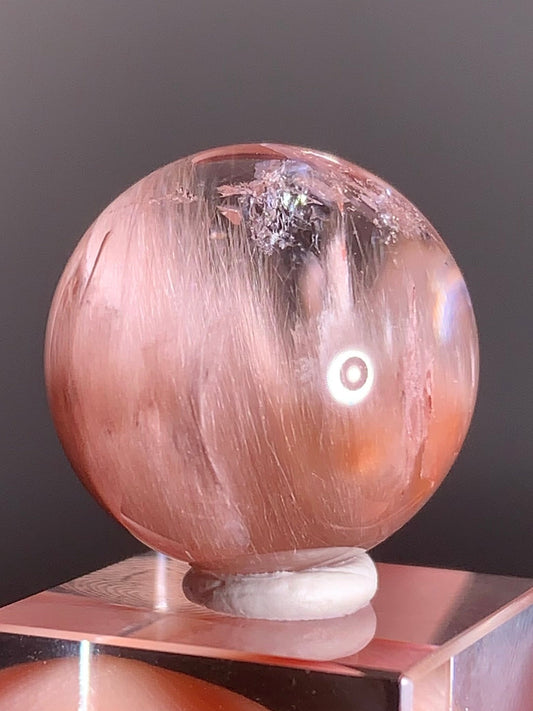 High-Clarity Pink Amphibole Sphere with Silky Textured Inclusions