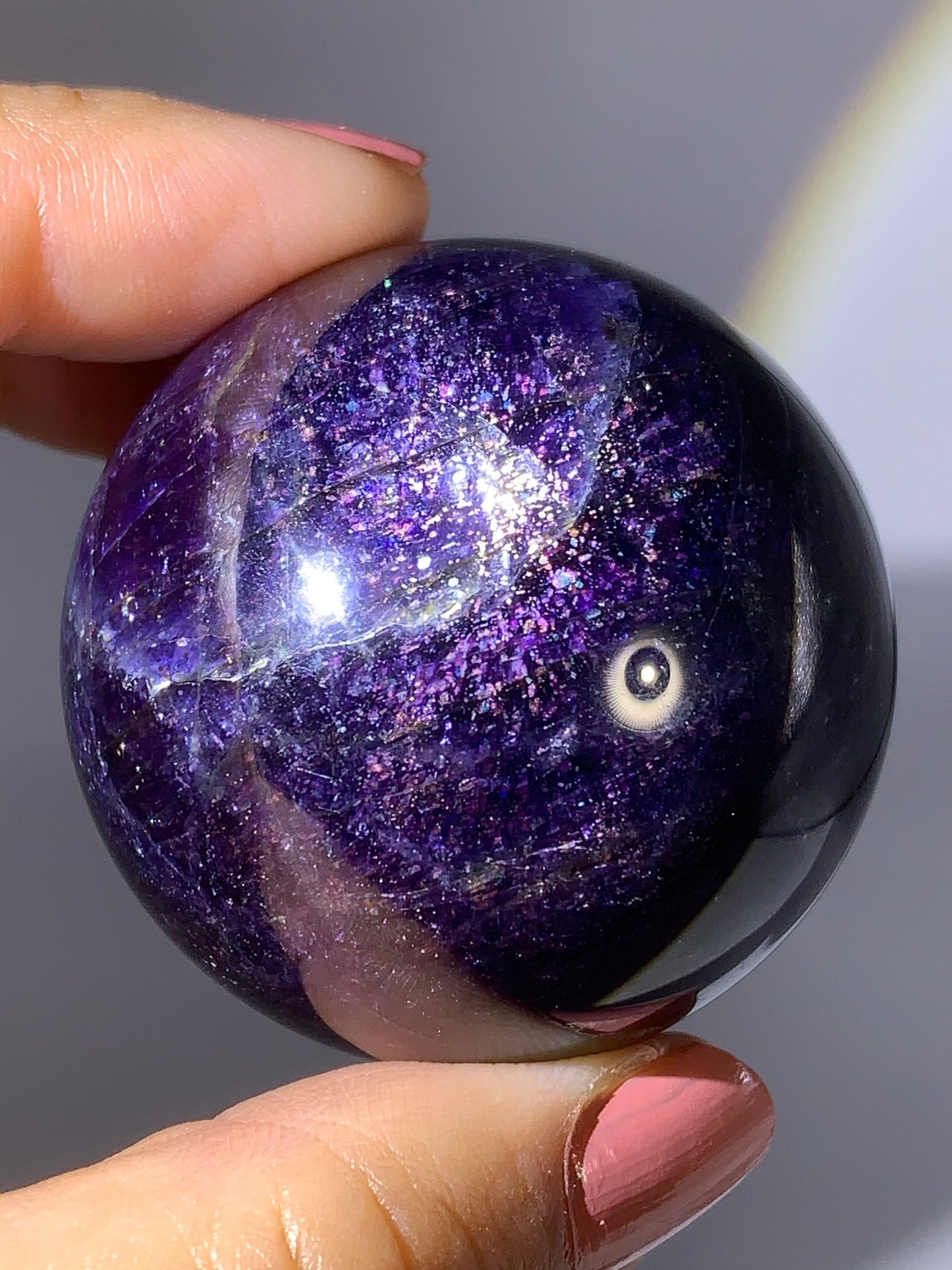 Natural High-Grade Galaxy Iolite and Sunstone Bloodshot Sphere from Tanzania