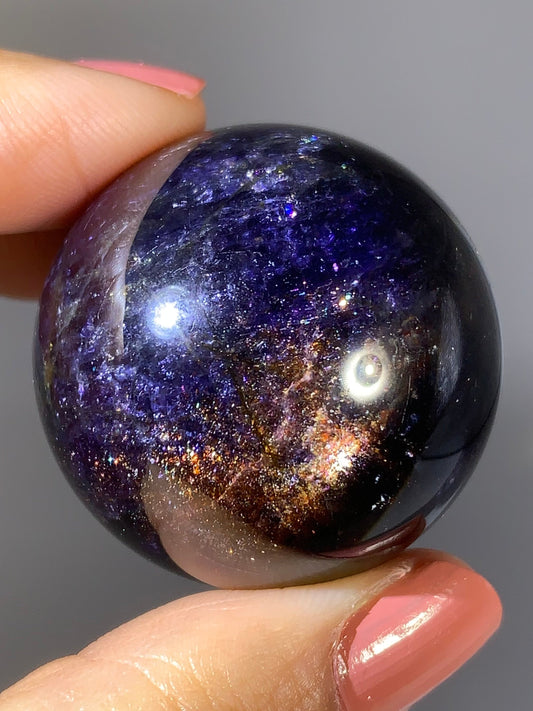Natural High-Grade Galaxy Iolite and Sunstone Bloodshot Sphere from Tanzania