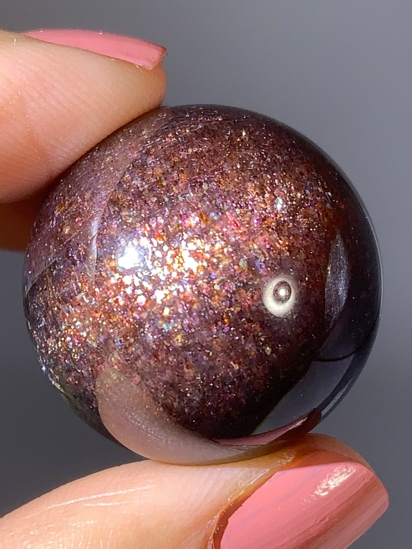 Natural High-Grade Galaxy Iolite and Sunstone Bloodshot Sphere from Tanzania