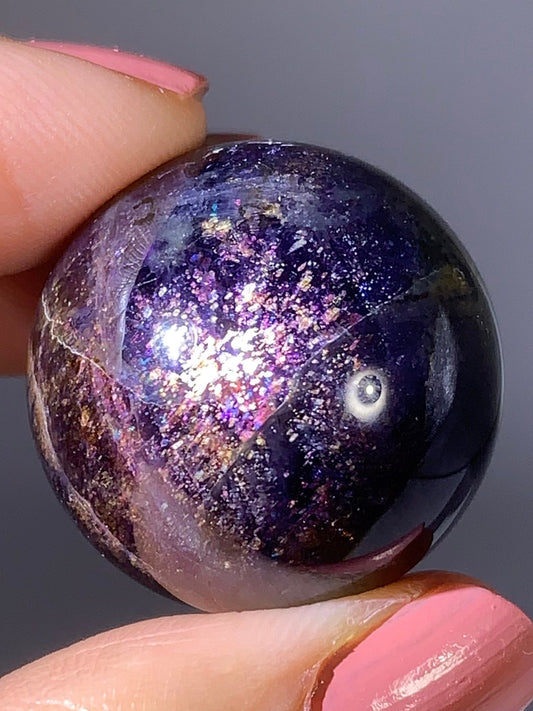 Natural High-Grade Galaxy Iolite and Sunstone Bloodshot Sphere from Tanzania