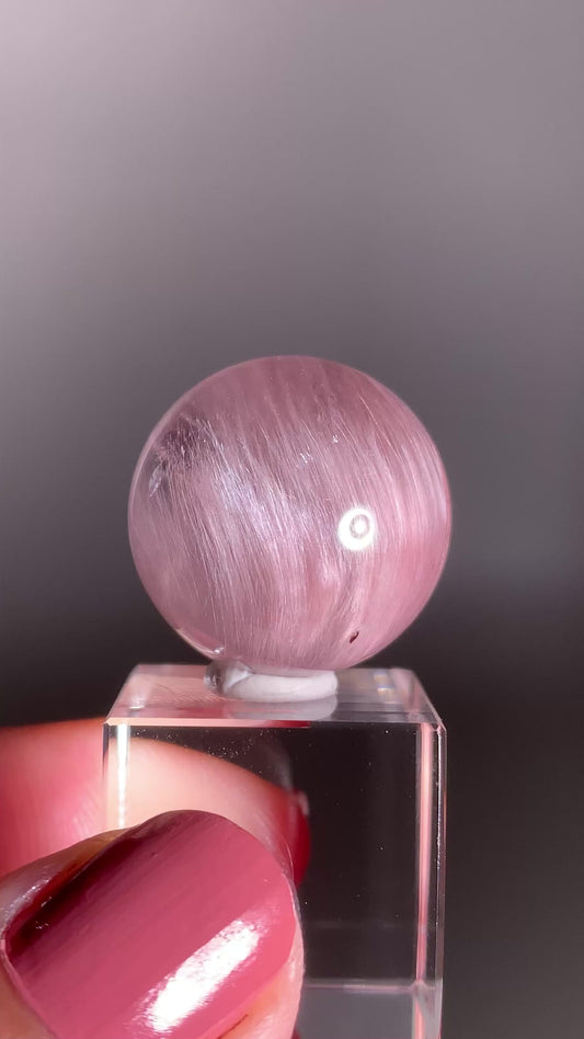 High-Clarity Pinkish Purple Amphibole Sphere with Silky Textured Inclusions